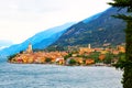 Ancient tower and fortress in old town Malcesine at Garda Lake. Mountains with clody sky in the background. Italian landscape. Royalty Free Stock Photo