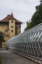 Ancient tower and modern greenhouse building in the Royal Garden near the Prague Castle. Prague. Czech Republic