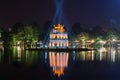 An ancient tower of the Turtle in beams of searchlights on the lake Hoankyem. Hanoi, Vietnam