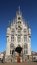 Ancient town hall building of the city Gouda in the Netherlands on the market square with blue sky Royalty Free Stock Photo