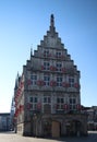 Ancient town hall building of the city Gouda in the Netherlands on the market square with blue sky Royalty Free Stock Photo