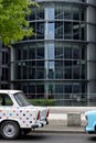 Ancient Trabant car. Vintage Trabant high-buildings parked in the German parliament district in Berlin