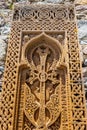 Traditional carved khachkar or cross-stone near Geghard Cathedral, close-up view. Armenian heritage and Art