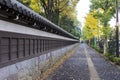 Ancient Traditional Japanese stone wall and old tiled roof and b Royalty Free Stock Photo