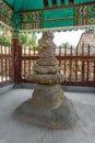 Ancient traditional Korean Pasa stone pagoda or wind-calming pagoda at the Royal tomb of king Suro of Gaya kingdom in Gimehae