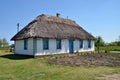 Ancient traditional ukrainian rural cottage with a straw roof, Ukraine Royalty Free Stock Photo