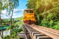 Ancient train running on wooden railway in Tham Krasae