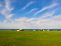 Ancient trulli, countryside, sea and clouds in Puglia