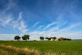 Ancient trulli, countryside, sea and clouds in Puglia