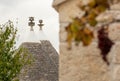 Ancient Trullo roof in the countryside, traditional old house and old stone wall in Puglia, Italy Royalty Free Stock Photo