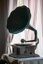 Ancient Turntables Placed on a window table with a pink curtain