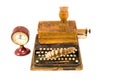 Ancient typewriter with old book and clock isolated Royalty Free Stock Photo