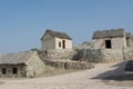 Ancient village street view with small huts and crossroads Royalty Free Stock Photo