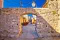 Ancient village of Sukosan near Zadar stone street and arch gate Royalty Free Stock Photo