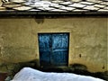 Ancient and vintage blue door, snow and history Royalty Free Stock Photo