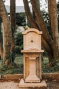 Ancient vintage concrete water fountain park trees Royalty Free Stock Photo