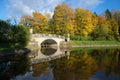 Ancient Viskontiyev Bridge in autumn landscape. Pavlovsk palace park. Saint-Petersburg