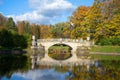 Ancient Viskontiyev Bridge in autumn landscape. Pavlovsk park, Russia