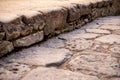 Ancient walking path stones texture. Ruins of ancient roman town Ercolano - Herculaneum