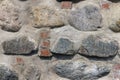 ancient wall of cobblestones and red bricks Royalty Free Stock Photo