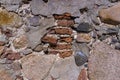 ancient wall of cobblestones and red bricks Royalty Free Stock Photo