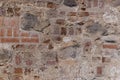 ancient wall of cobblestones and red bricks Royalty Free Stock Photo