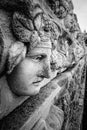 Ancient wall with mask relief of Aphrodisias Afrodisias Ancient City in Caria, Karacasu, Aydin, Turkey.