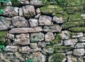 Ancient wall masonry from chipped granite blocks. Wall stone pattern Royalty Free Stock Photo