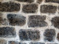 Ancient wall masonry from chipped granite blocks. Wall stone pattern Royalty Free Stock Photo