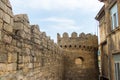 Ancient wall of old Baku. Old walls and new buildings together in Icheri sheher Royalty Free Stock Photo