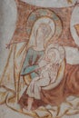 Ancient wall-painting of Virgin Mary and the child on her laps in the stable Royalty Free Stock Photo