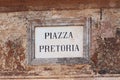 Ancient wall plate with name of city square `Piazza Pretoria`. Palermo, Sicily