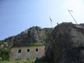 Ancient Wall rises on the mountain to the Fortress St Jons over Kotor in Montenegro Royalty Free Stock Photo