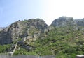 Ancient Wall rises on the mountain to the Fortress St Jons over Kotor in Montenegro Royalty Free Stock Photo