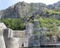 Ancient Wall rises on the mountain to the Fortress St Jons over Kotor in Montenegro Royalty Free Stock Photo