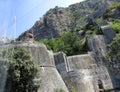 Ancient Wall rises on the mountain to the Fortress St Jons over Kotor in Montenegro Royalty Free Stock Photo