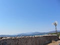 Ancient wall and windmill with seascape Royalty Free Stock Photo