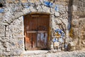 Ancient walls and and entrance wooden door at Rhodes old town, Greece Royalty Free Stock Photo