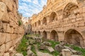 Ancient walls of Roman temple of Bacchus with surrounding ruins and blue sky in background, Beqaa Valley, Baalbeck, Lebanon Royalty Free Stock Photo