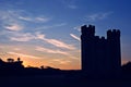 Ancient watchtower silhouette at sunset