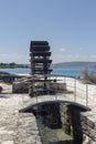 Ancient water mill in karst sinkhole near the sea (Greece, Argostoli, Kefalonia) Royalty Free Stock Photo