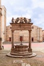 The ancient water well Pozzo dei Grifi e dei Leoni on the central Piazza Grande in Montepulciano, Tuscany, Italy Royalty Free Stock Photo