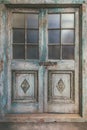 Ancient weathered double entrance door