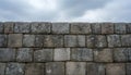Ancient Weathered Stone Wall Texture Under Cloudy Sky Background Royalty Free Stock Photo