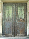 An ancient weathered stylish old wooden door