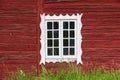 Ancient weathered white window in a red wooden Swedish house, Scandinavian style house Royalty Free Stock Photo