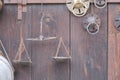 Ancient weighing machine hanging on wood background Royalty Free Stock Photo