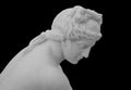 Ancient white marble sculpture head of young woman. Statue of sensual renaissance art era woman antique style. Face