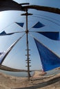 Ancient wind mill use for move the sea water into the salt field. Royalty Free Stock Photo