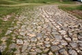 Ancient winding road paved with cobblestone . Royalty Free Stock Photo